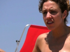 sexy-brunette-woman-topless-beach-voyeur