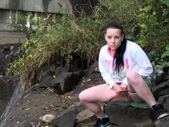 raven-haired-girl-pees-near-the-river