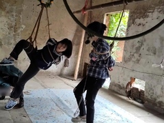 two-girls-suspended-in-an-abandoned-house